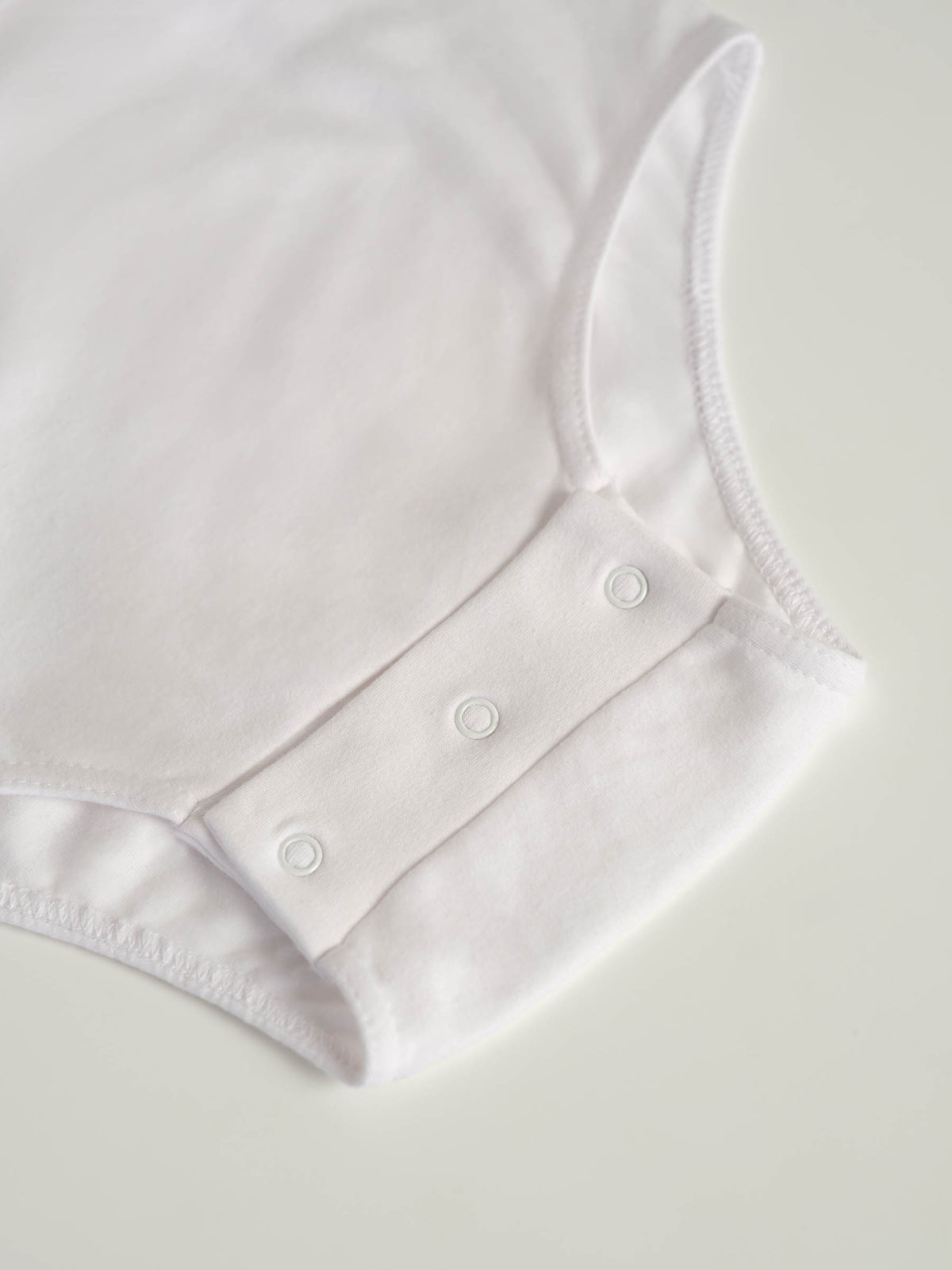 Bodysuit med trykknapper i skrittet (2010)