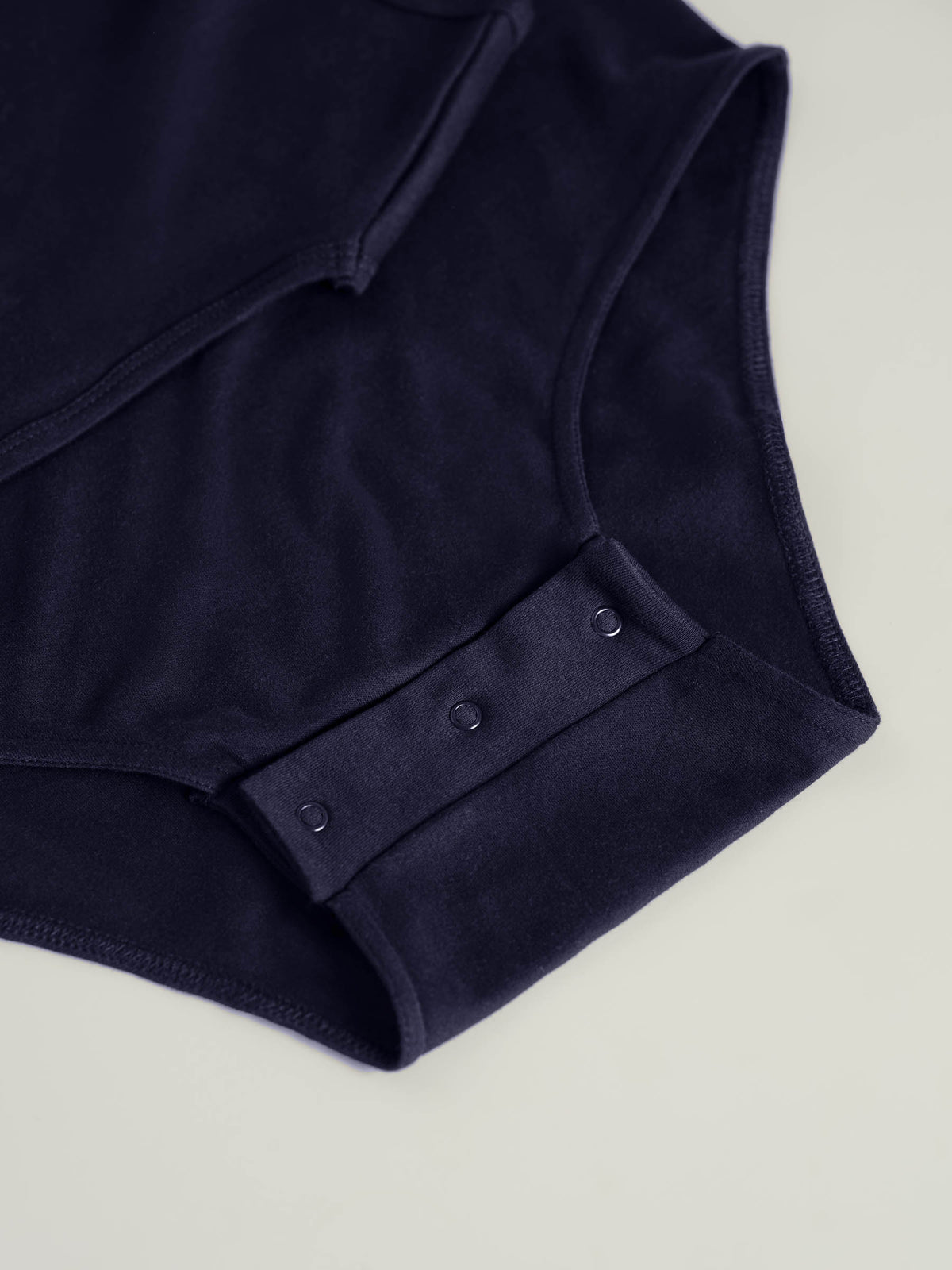 Bodysuit med trykknapper i skrittet (2010)