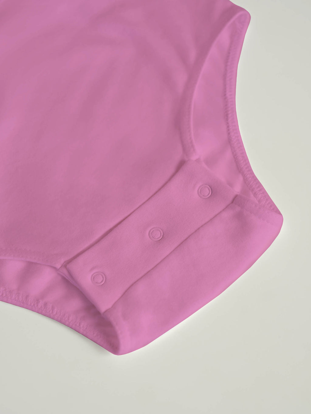 Bodysuit med trykknapper i skrittet (2010)