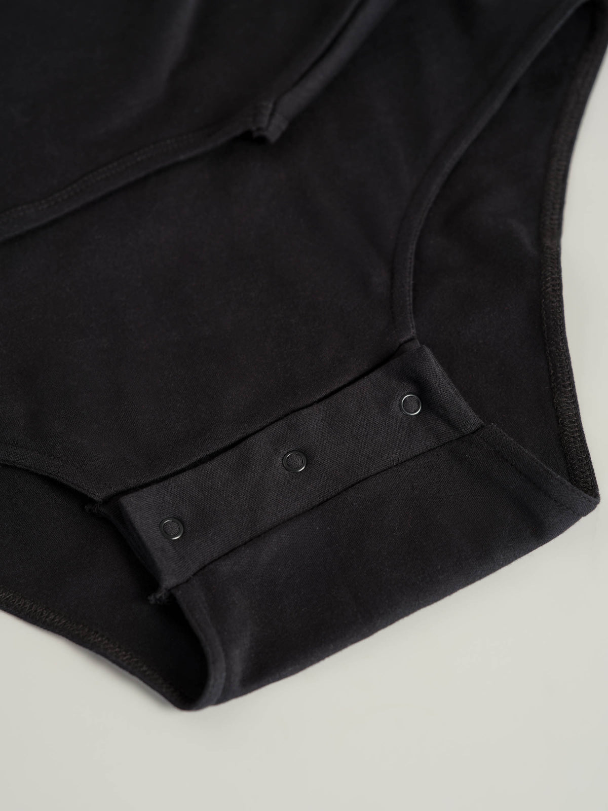 Bodysuit med trykknapper i skrittet (2010)